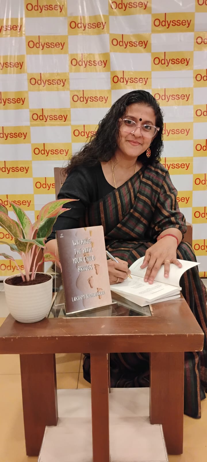 Lakshmi Sudhakaran signing books at Odyssey
