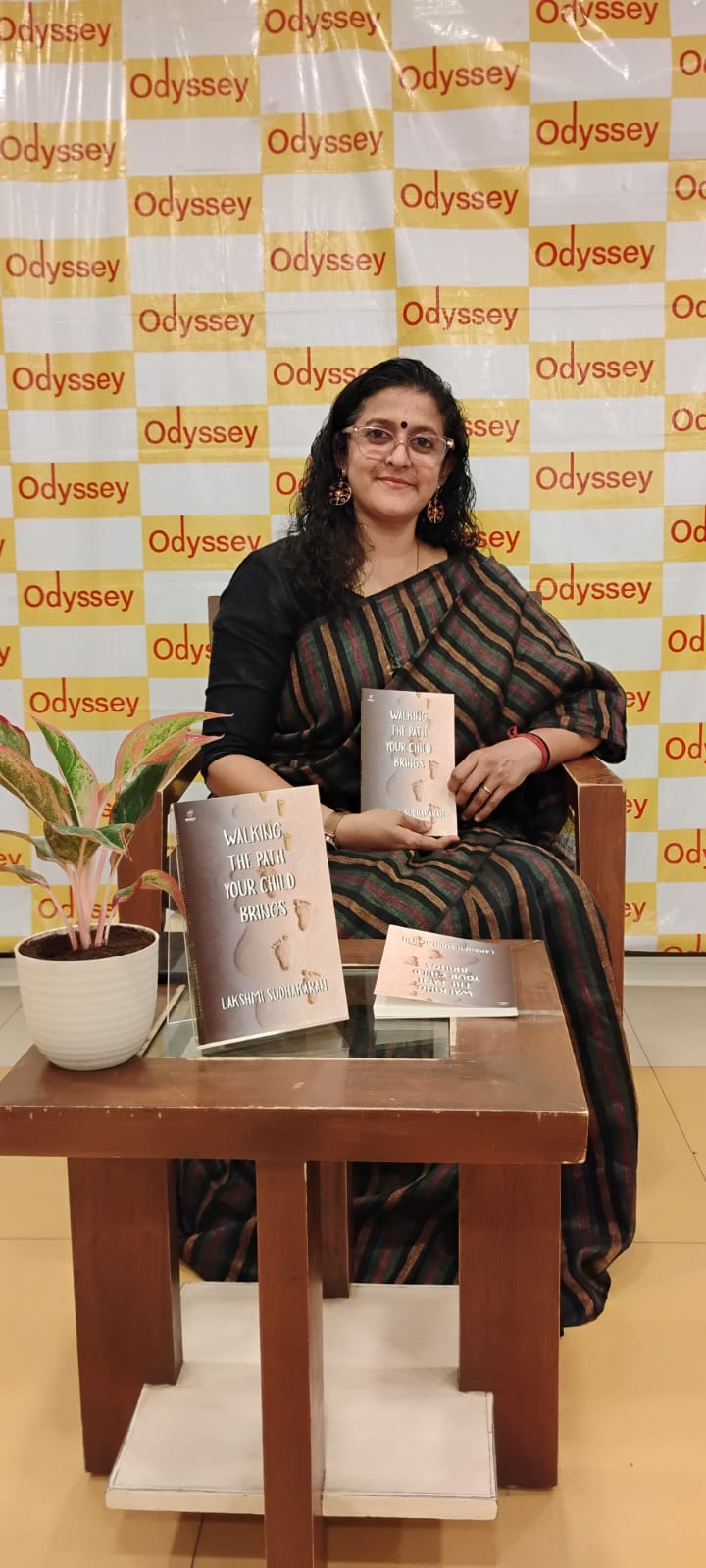 Lakshmi Sudhakaran with her book at Odyssey